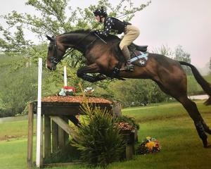 Georgie Cooper jumping on her horse