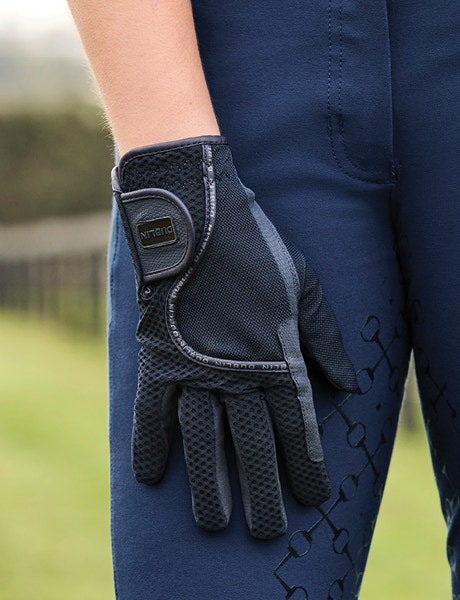 Close up of rider's hands wearing Dublin gloves