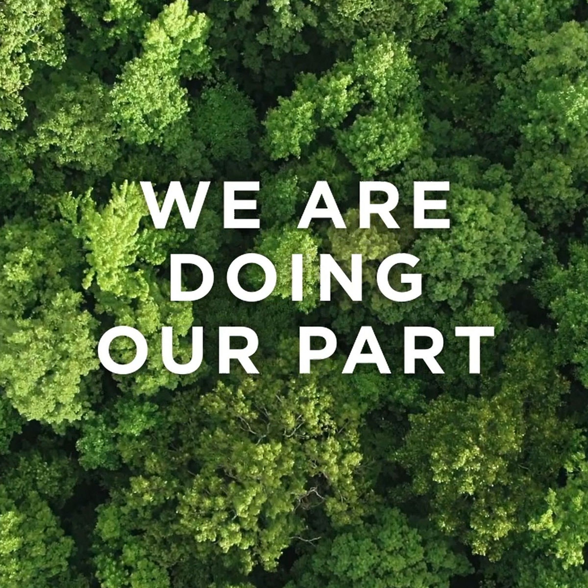 Top view of green forest with We Are Doing Our Part words overlaid on top